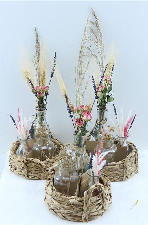 Basket with 3 bottles with pink dry flowers arrangements